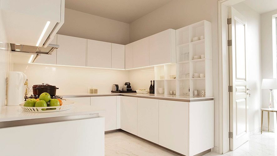 residence_kitchen Modern kitchen featuring sleek white cabinetry, quartz countertops, and BOSCH appliances, ideal for culinary enthusiasts.